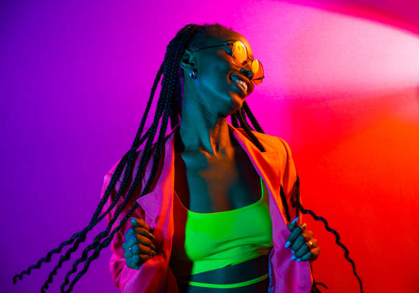 Beautiful afro-american woman with afro pigtails hairstyle and stylish clothes - Portrait of young black girl in studio